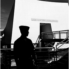 Soldier stands in front of USS Arizona Memorial