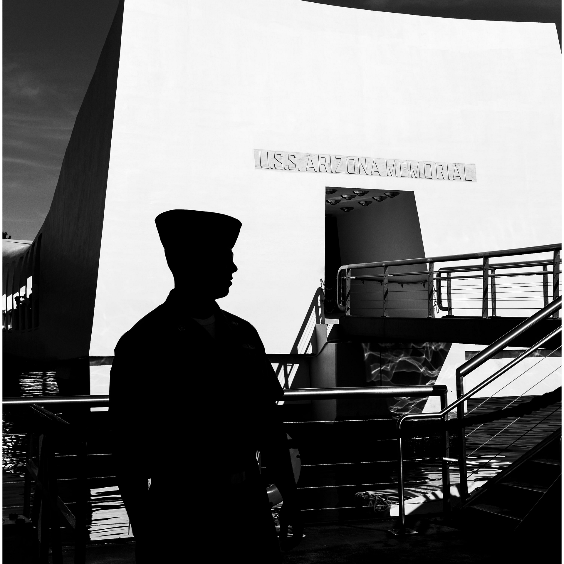 Soldier stands in front of USS Arizona Memorial