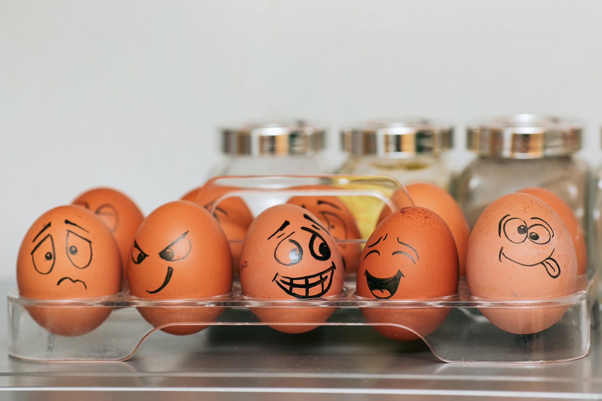 Eggs in a carton with faces drawn on